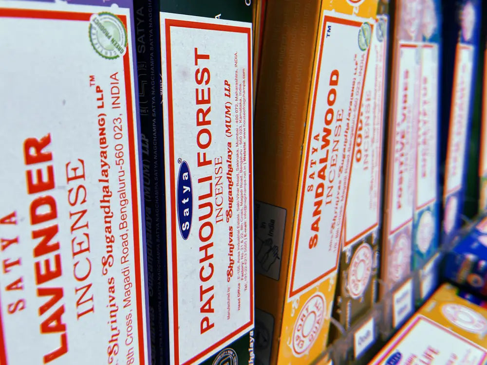 A shelf of boxed Satya incense - lavender, patchouli forest and sandalwood.