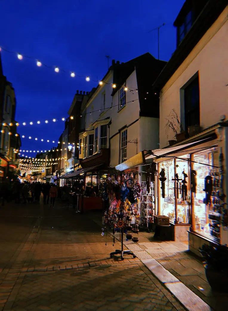 George Street at dusk - strings of fairy lights over the Old Town and the lit windows of Goldenhands on the right.